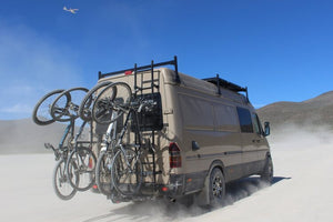 Sprinter van with 6 bike vertical Lolo Rack. Mountain bikes and road bikes